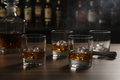 Smoked Glass Whiskey Tumbler Set on walnut bar