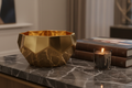 Geometric Brass Metal Decorative Bowl on dark marble